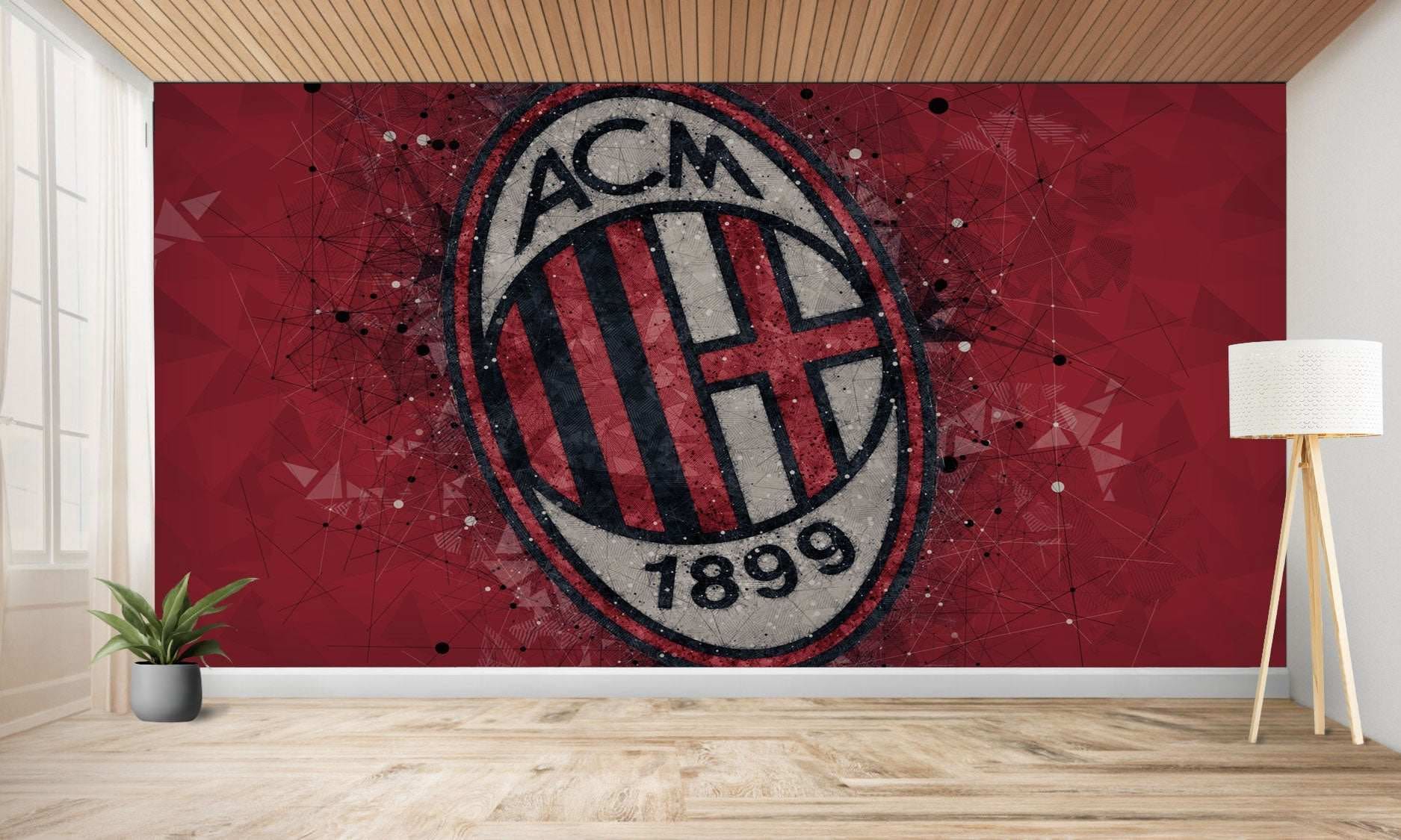 Une peinture murale rouge représentant le logo du club de football AC Milan avec un effet vieilli.