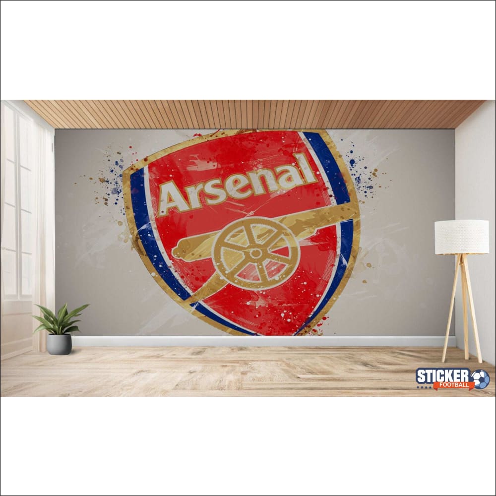 Une grande représentation artistique de l’écusson du club de football d’Arsenal sur un mur.