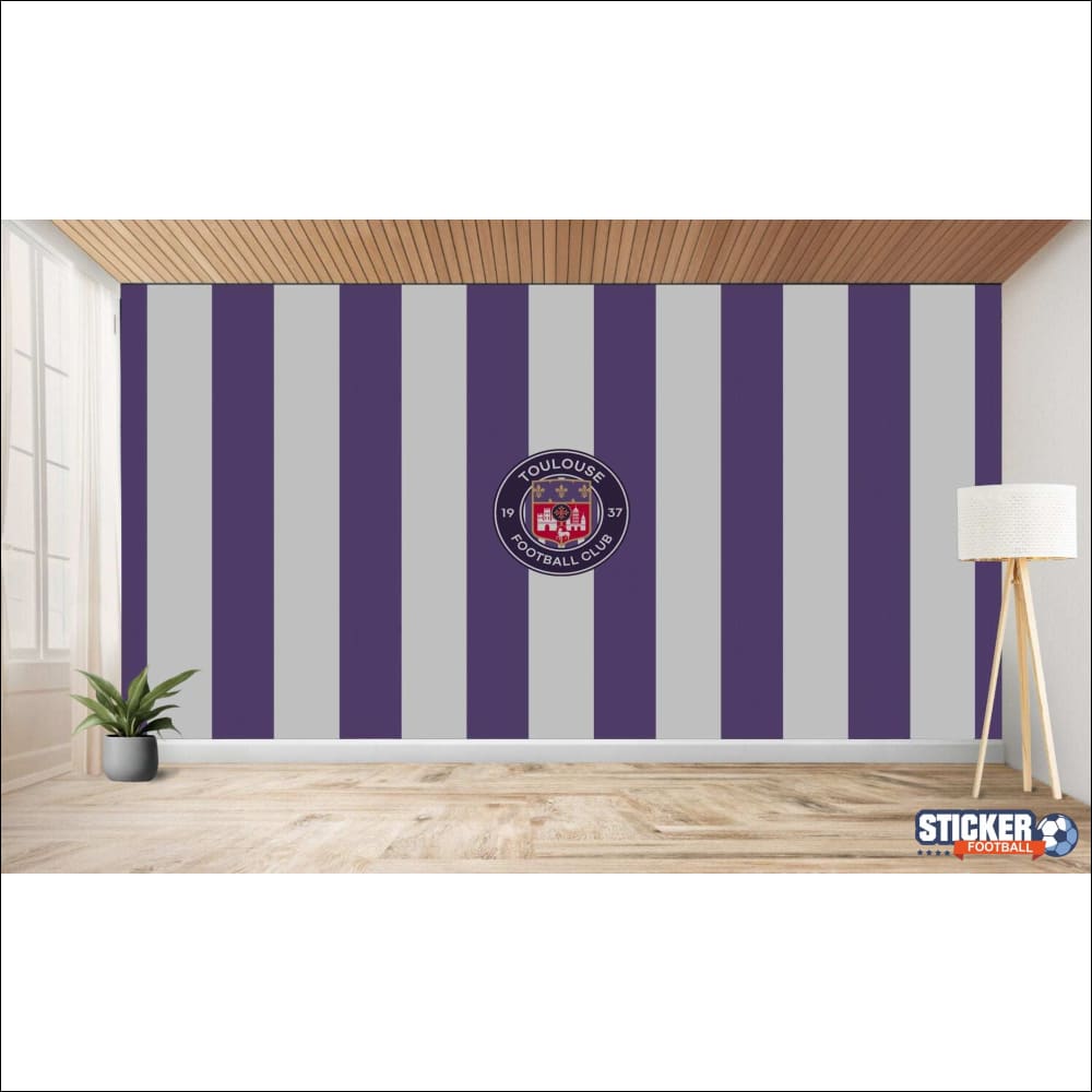 Mur rayé avec le logo du Toulouse Football Club.