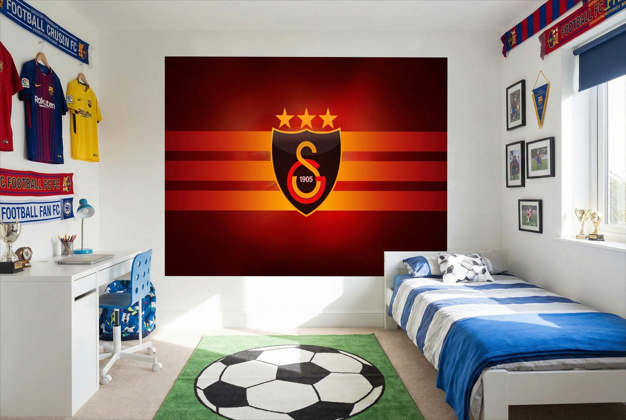 Papier peint logo galatasaray avec un motif rayé rouge et orange et l’emblème noir or blanc pour déco fan soccer